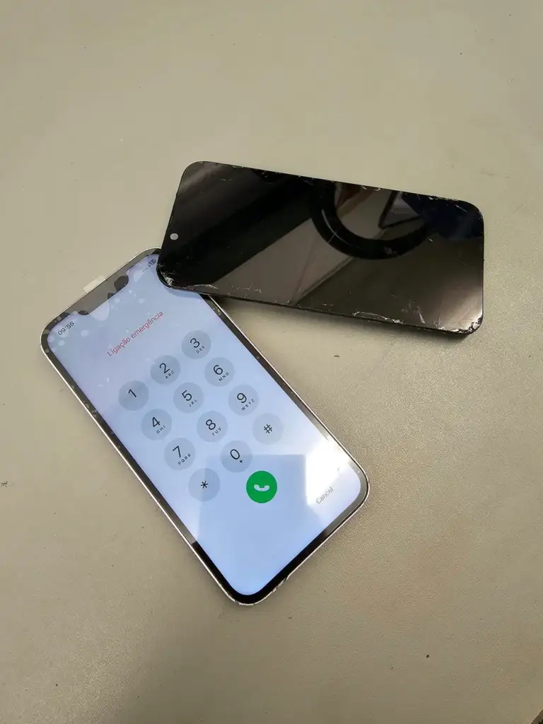 A Broken iPhone screen with the working device and a screeen replacement below it showing the Emergancy Call keyboard